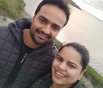 Arzoo and her husband by the water