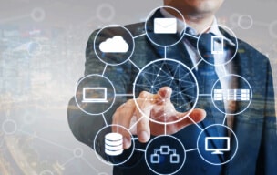 Businessman interacting with digital network icons